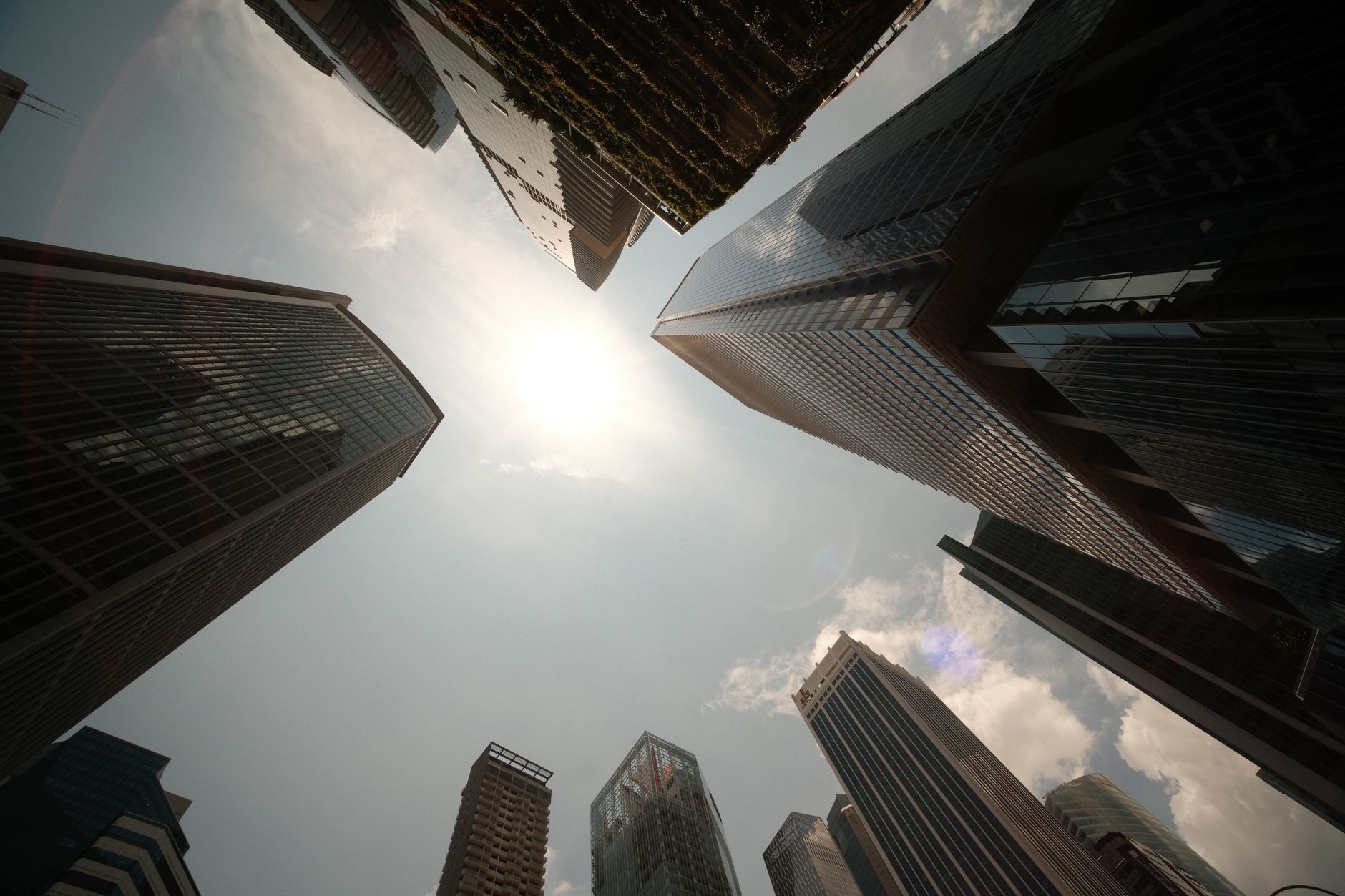 Sleek skyscrapers of Singapore financial center looking upward