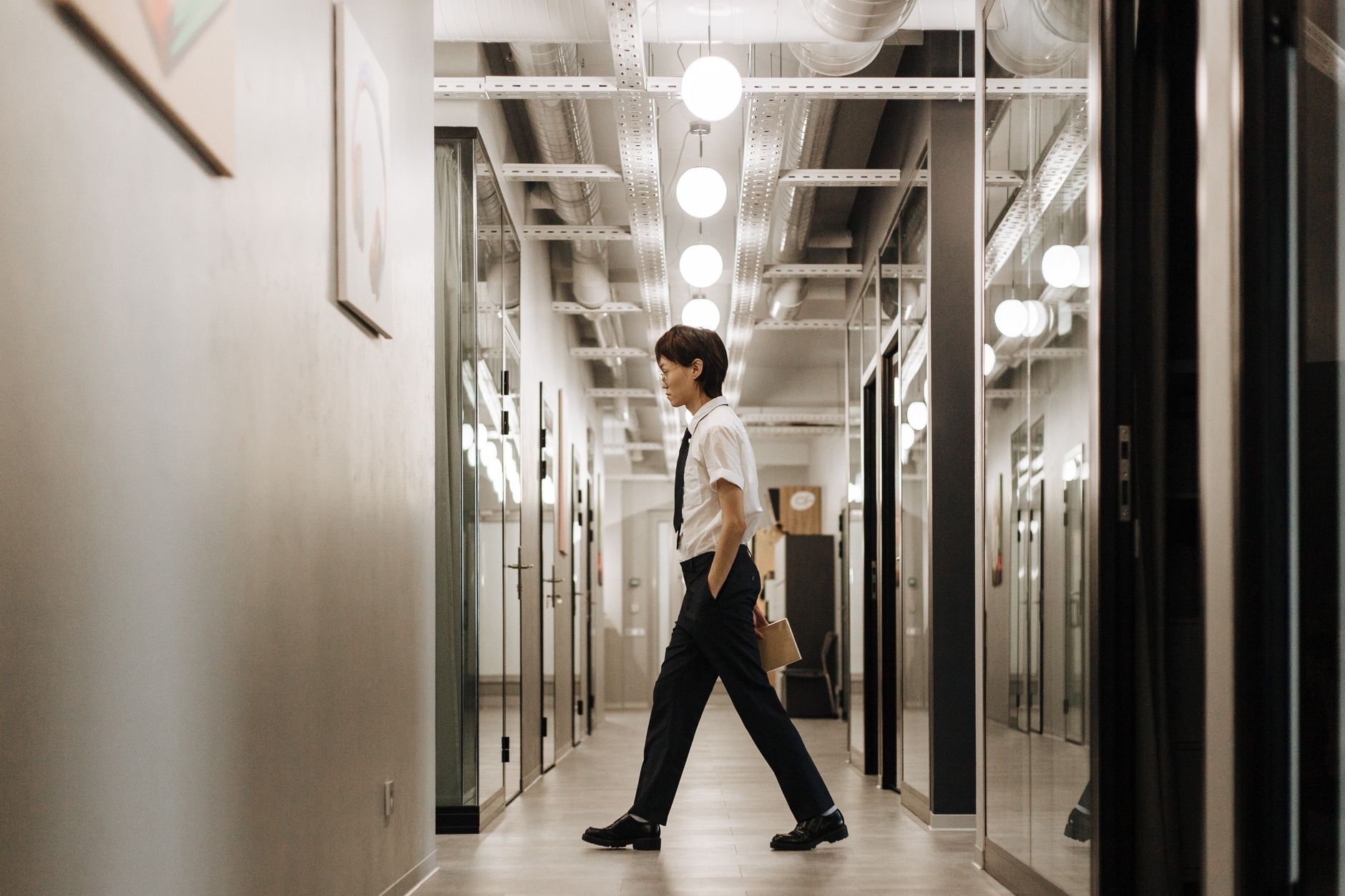 A private wealth consultant walking down premium lobby